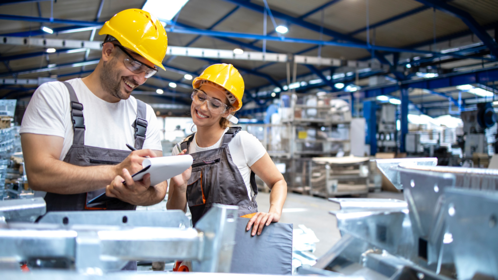 two workers in manufacturing facility