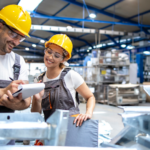 two workers in manufacturing facility