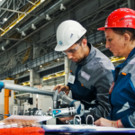 two workers in futuristic warehouse